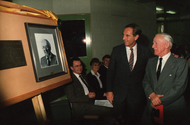 Photograph- Colour, Premier John Cain and Morgan B. John admire a portrait and plaque at the opening of the Ballarat School of Mines M.B. John Building, 1987, 11/06/1987