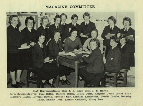 A teacher is surrounded by numerous feamil students
