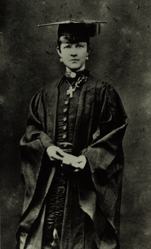 A woman in academic regalia