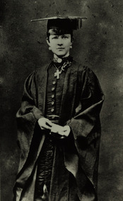 A woman in academic regalia
