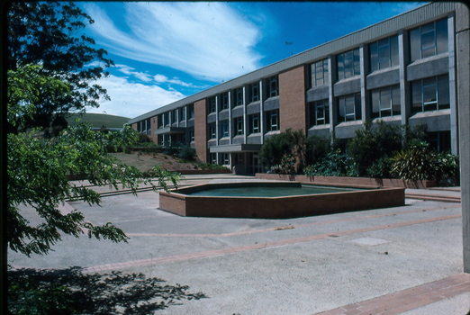 brick building behind courtyard