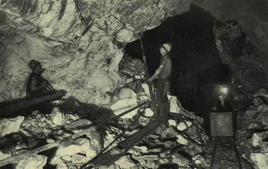 Photograph - black and white, Miners at work underground with a pneumatic drill