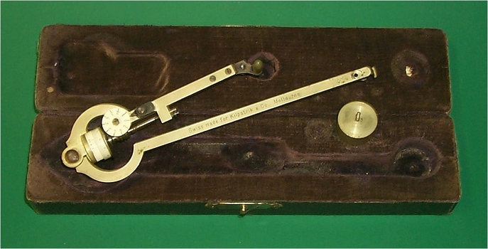 boxed brass instrument