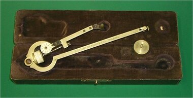boxed brass instrument