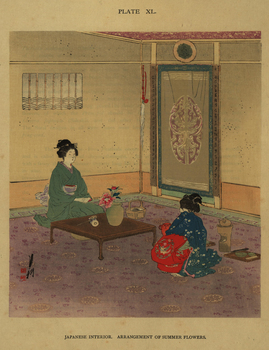 Two Japanese women with table and vase of flowers