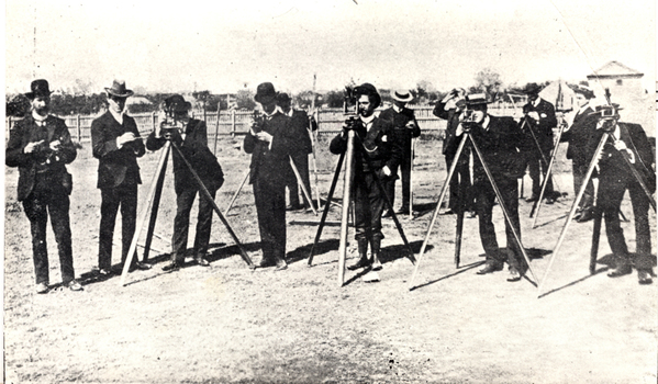 12 men during a surveying activity