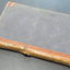 A large ledger with leather spine