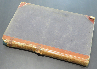 A large ledger with leather spine