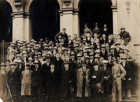 A group on teh steps of a public building