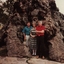 Three people at a large tree