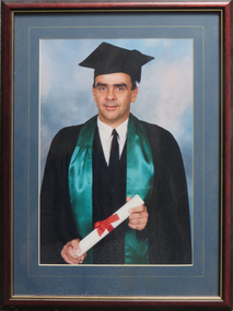 Portrait of Wayne Muir in academic regalia