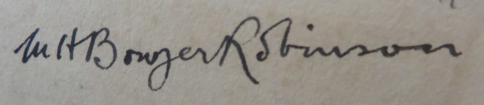 Signature in front of book