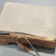 Front cove of book showing deteriorated spine