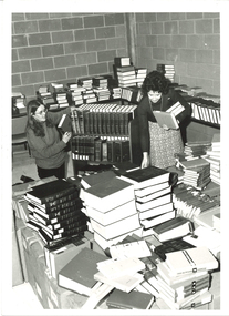 Photograph - Photograph - Black and White, Two Female Librarians Sorting Through Books at Ballarat College of Advanced Education, Mount Helen Campus, "mid to late 1980's"