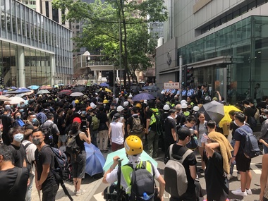 Photograph - Photograph - Colour, Jarrod Watt, Seven police officers stand guard in front of Hong Kong's main police headquarters on Arsenal Street in Wan Chai, 2019, 21/06/2019