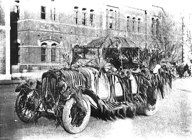 A decorated car in a procession