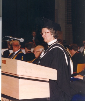 A woman in academic regalia