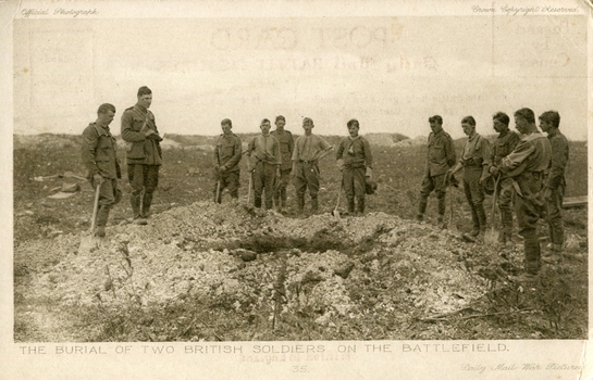 Soldiers stand around a grave