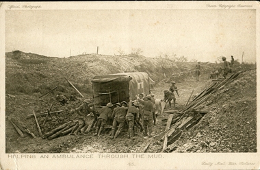 Soldiers pushing an ambulance