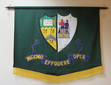 textile banner with the Ballarat School of Mines crest in applique