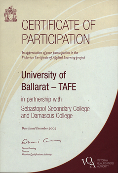 A certificate with text, and and a maroon patch in the lower right corner