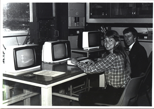 Two people at a computer