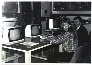 Two people at a computer