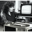 A woman and a man at a Microbee computer