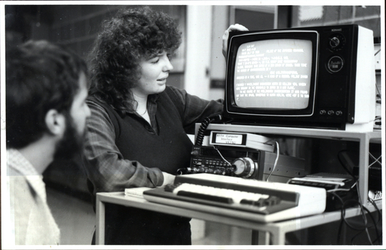 A woman and a man at a Microbee computer