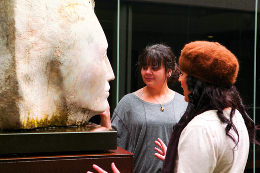 Two students with a sculpture