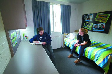 Two students in a room on Student Res.