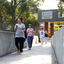 Students walk across a bridge