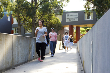Students walk across a bridge