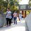 Students walk across a bridge