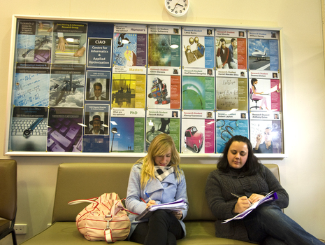 Two students on a couch