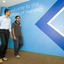 Two men walk in the School of Nursing
