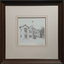 A framed drawing of a double storey building