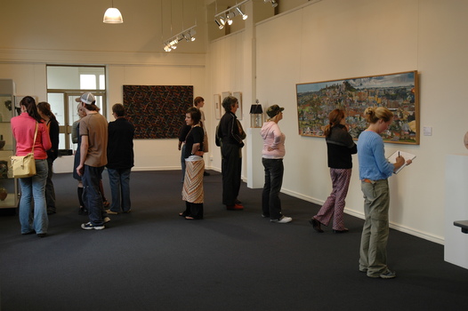 University students at an art exhibition