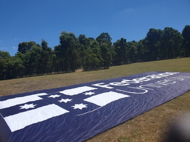 Photograph, Federation University Banner during the 2021 Australian Cycling Road Nationals, 03/02/2021