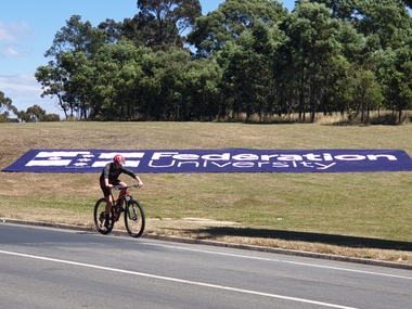 A cyclist on University Drive
