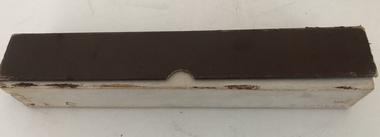 Piano Roll in white box with brown lid