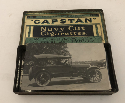 Cigarettte tin containing photos and negatives 