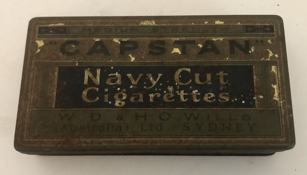 Cigarette tin containing photos and negatives