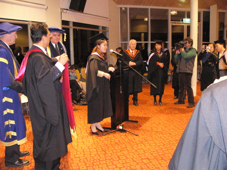 Graduate addressing audience
