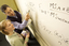 Lecturer instructing student