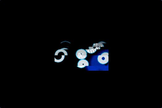 Still image of animated sequence of moving white and blue circles of various sizes, with glimpses of typography on black background.