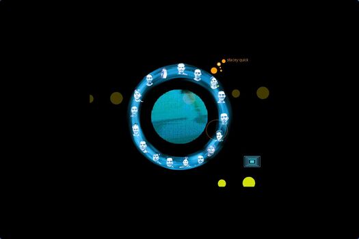 A central blue circle is ringed by small photographs of students. Touching student with cursor activates their name. Other circles float on a black background.