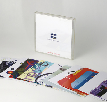 Hard plastic transparent hinged case holds 17 printed cards featuring student work.