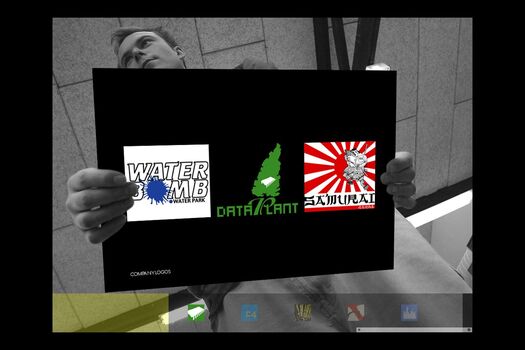 Black and white photograph of student, viewed from below holding a coloured presentation card of their work: three logos