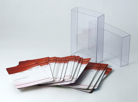 Two-piece acetate pack containing standard deck of playing cards, each featuring student work. Fanned display of card reverse.